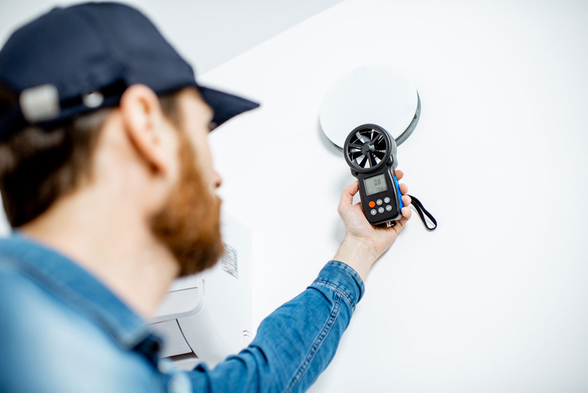 handyman checking air ventilation