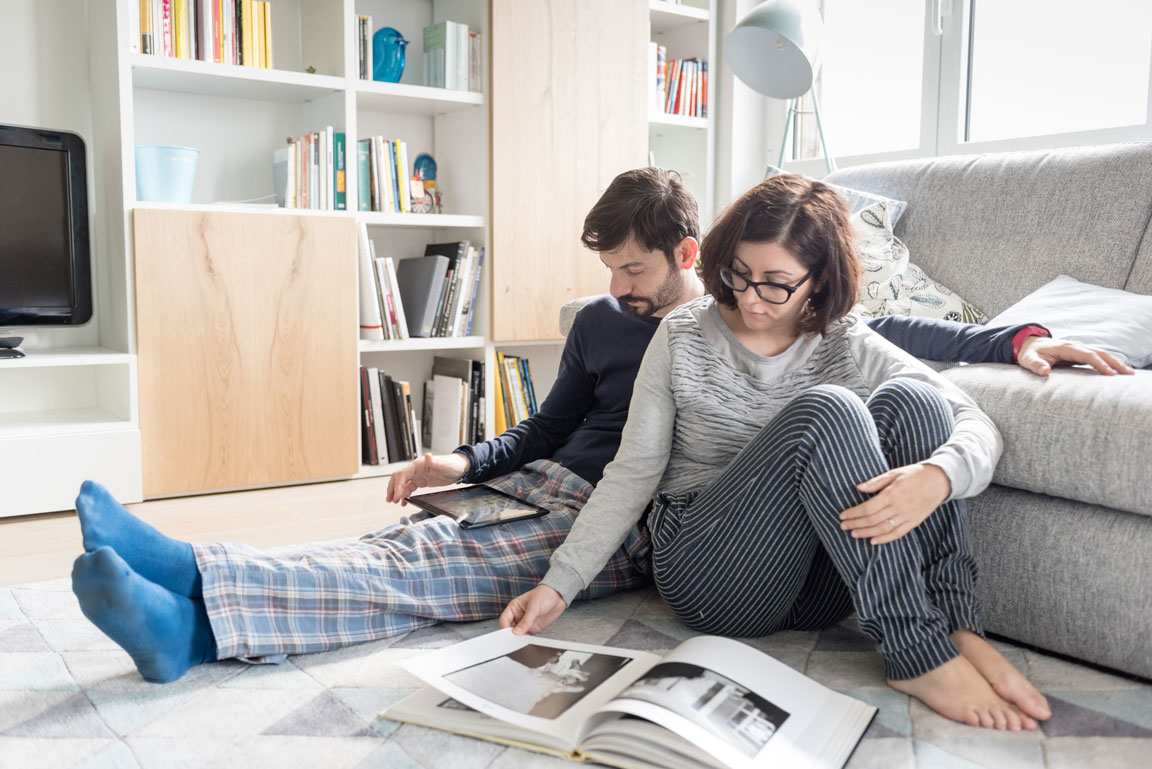 couple sitting indoors within their home