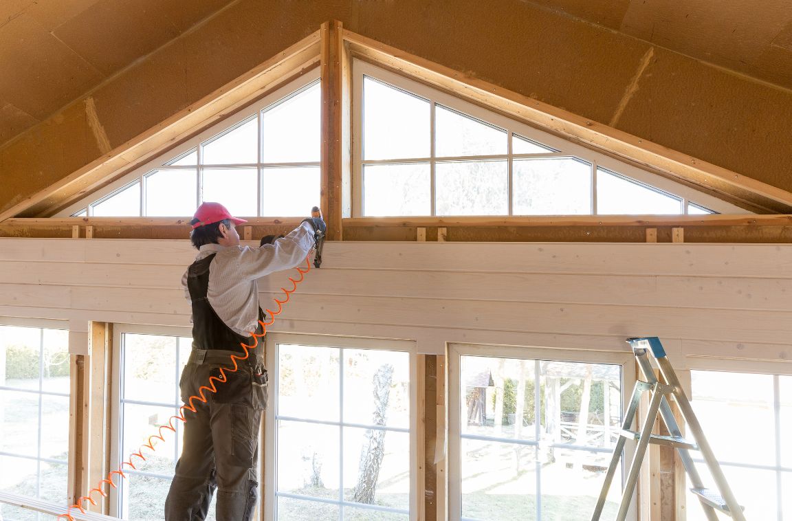 person doing an insulation job in a home