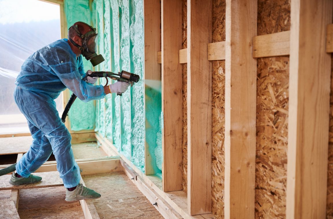 person installing spray foam