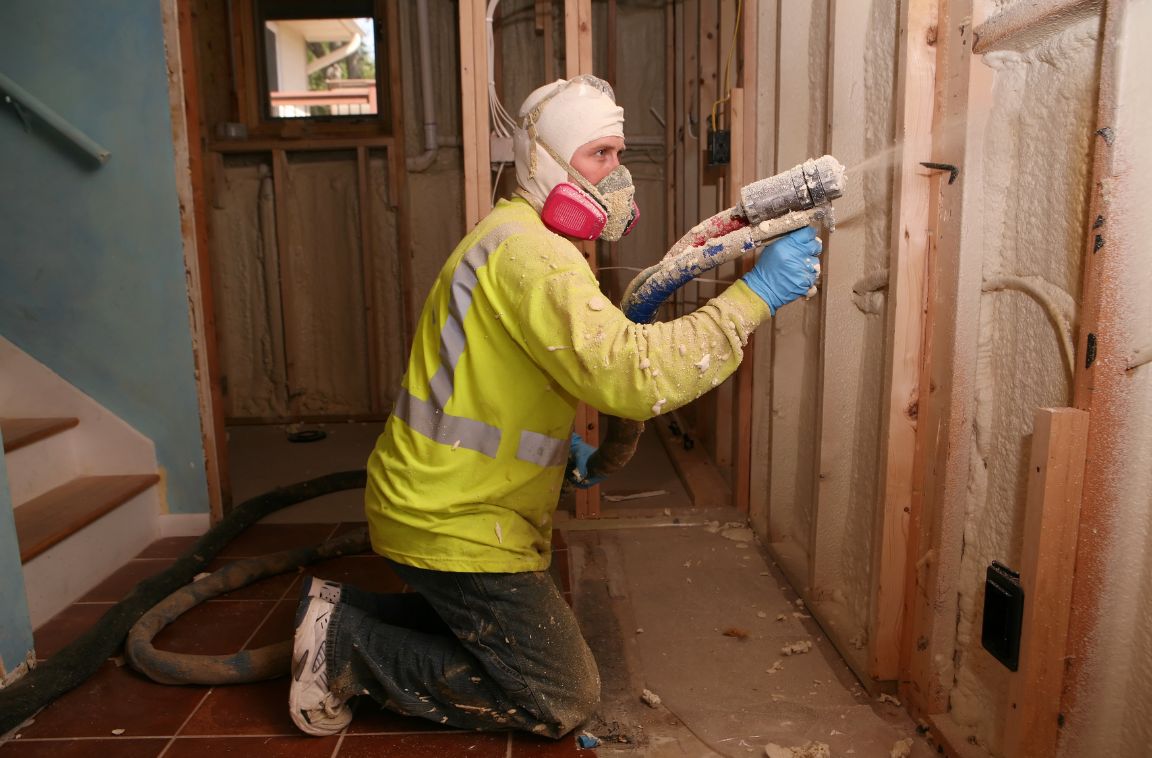 insulation expert installing spray foam