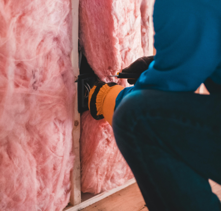 contractor installing insulation upgrades